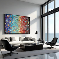 Large colorful abstract canvas painting with drip and splatter texture in a luxury living room, modern abstract wall art for home interiors