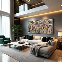 Modern living room with a large abstract painting on the wall, a gray sofa, and a green armchair.